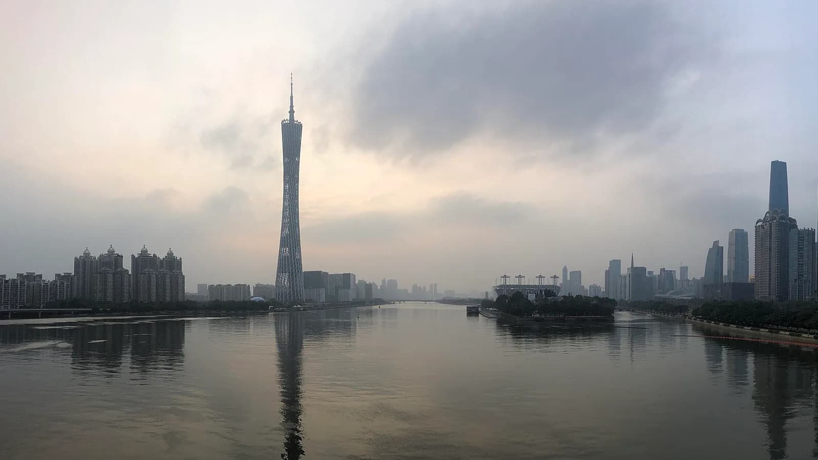 Guangzhou’s skyline rising above the Pearl River at blue hour