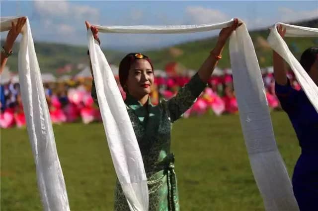 A Tibetan welcome with ceremonial white hada scarves
