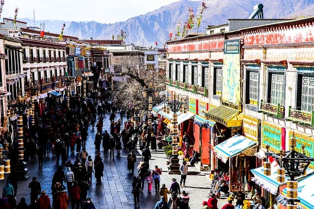 Pilgrims and visitors moving through Barkhor Street