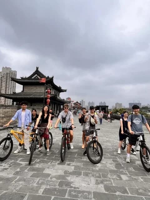 Travelers cycling on Xi’an City Wall
