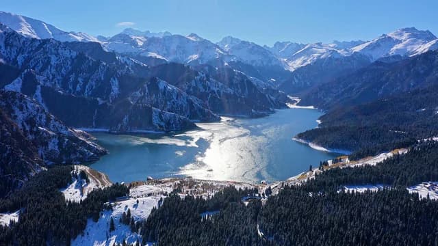 Heavenly Lake surrounded by the Tianshan mountains